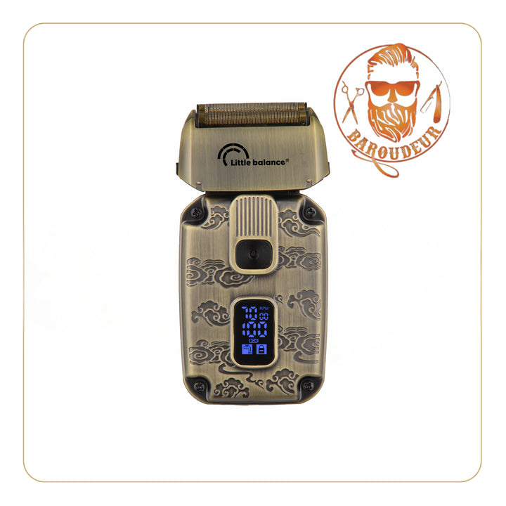 Sahara Explorer - Little Balance Razor: compact electric shaver with engraved vintage design, sturdy copper housing, LED display showing speed and battery, floating head, integrated foil trimmer, two cutting speeds, corded or cordless use, IPX6 certified.