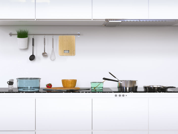 A slim bamboo usb kitchen scale. The scale is attached by a hanging ring.